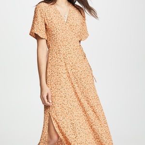 Faithfull the brand printed orange wrap dress. size S